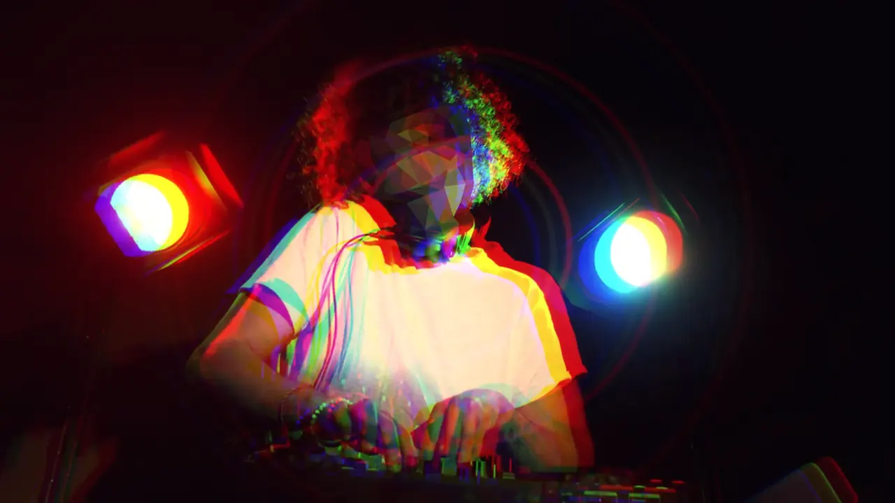 On the drop: an RGB split and beat rings over the masked DJ